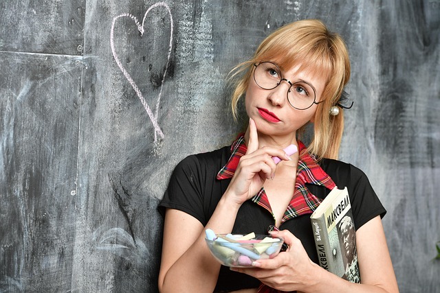 reading a digital guide on a laptop with Canada themed learning materials